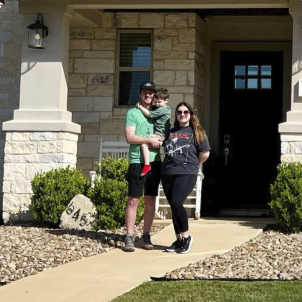 picture of Madelyn Q. in front of a house